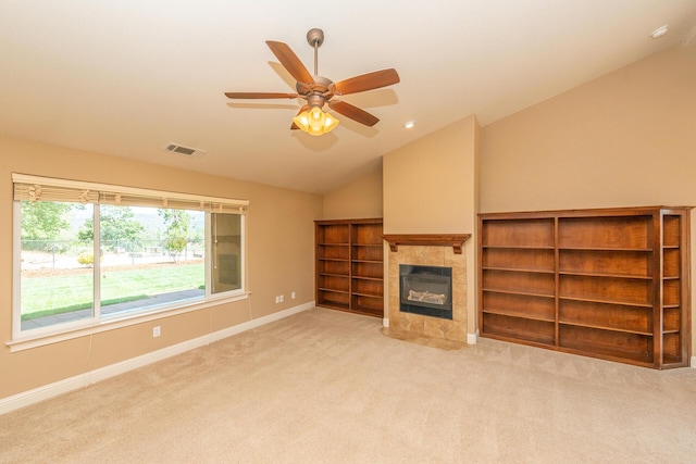 2926 Chaucer Way, Shasta Lake, CA 96019 - unfurnished living room with vaulted ceiling, a tile fireplace, carpet floors, ceiling fan, and recessed lighting