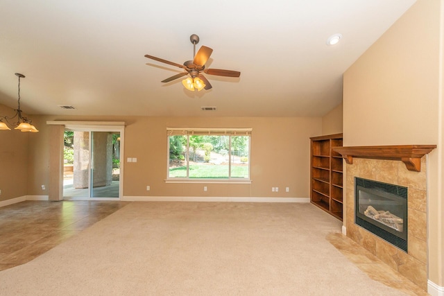2926 Chaucer Way, Shasta Lake, CA 96019 - unfurnished living room featuring plenty of natural light, a tiled fireplace, light carpet, and a ceiling fan