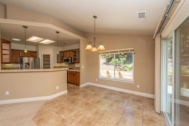 2926 Chaucer Way, Shasta Lake, CA 96019 - kitchen featuring brown cabinetry, appliances with stainless steel finishes, glass insert cabinets, light countertops, and vaulted ceiling
