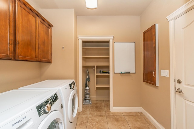 2926 Chaucer Way, Shasta Lake, CA 96019 - laundry room with cabinet space, washing machine and clothes dryer, and light tile patterned floors