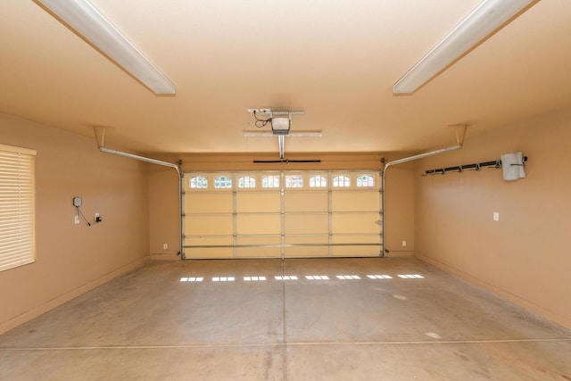 2926 Chaucer Way, Shasta Lake, CA 96019 - garage featuring a garage door opener and baseboards