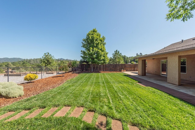 2926 Chaucer Way, Shasta Lake, CA 96019 - fenced backyard featuring a mountain view and a patio