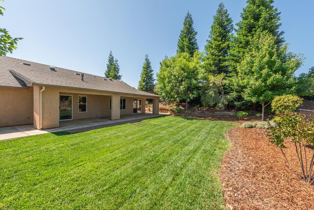 2926 Chaucer Way, Shasta Lake, CA 96019 - view of green lawn featuring a patio area