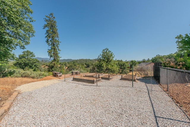 2926 Chaucer Way, Shasta Lake, CA 96019 - view of yard featuring a garden and a mountain view