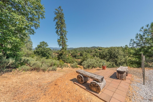 2926 Chaucer Way, Shasta Lake, CA 96019 - view of yard with a patio area and a forest view