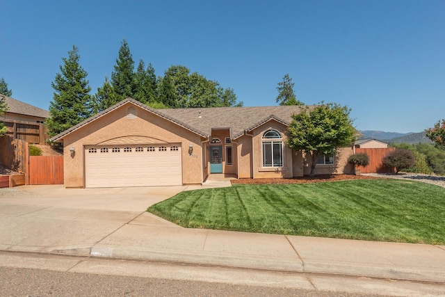 2926 Chaucer Way, Shasta Lake, CA 96019 - single story home featuring stucco siding, a garage, and driveway