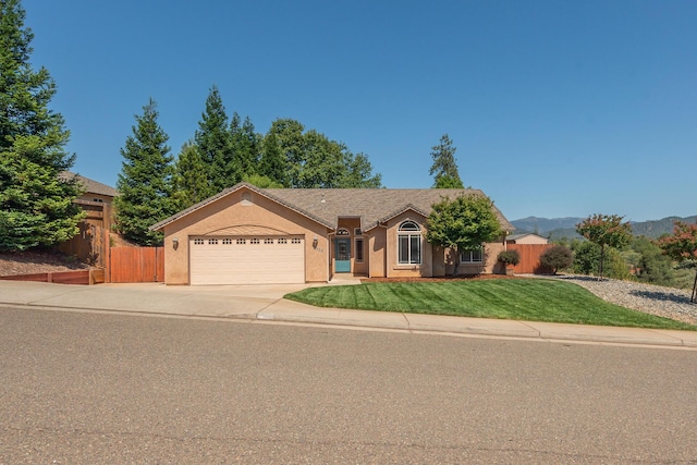 2926 Chaucer Way, Shasta Lake, CA 96019 - ranch-style house with an attached garage, concrete driveway, stucco siding, and a mountain view