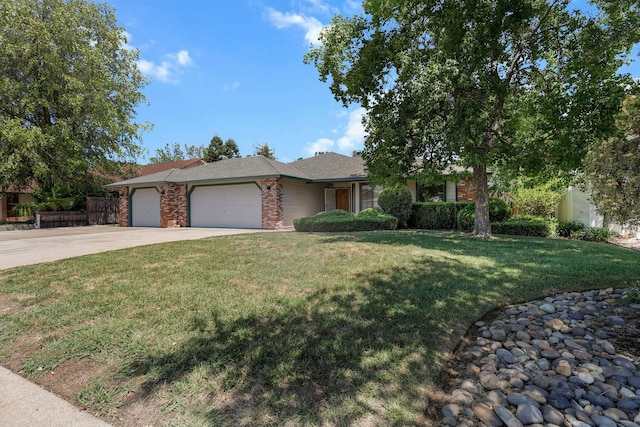 2820 Howard Dr, Redding, CA 96001 - view of front facade featuring an attached garage, driveway, and brick siding