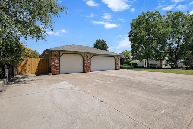 2820 Howard Dr, Redding, CA 96001 - view of front facade featuring a garage, driveway, and brick siding