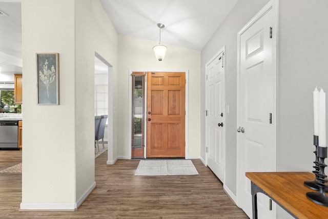 2820 Howard Dr, Redding, CA 96001 - entrance foyer featuring wood finished floors and vaulted ceiling