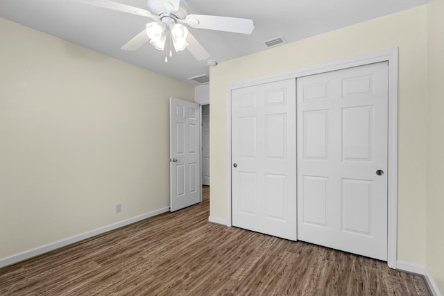 2820 Howard Dr, Redding, CA 96001 - unfurnished bedroom featuring wood finished floors, a closet, and ceiling fan