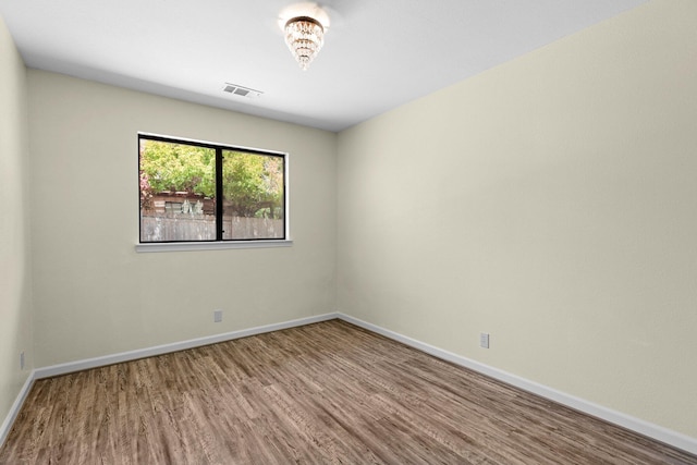 2820 Howard Dr, Redding, CA 96001 - spare room featuring wood finished floors and baseboards