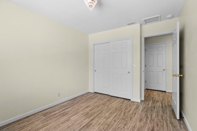 2820 Howard Dr, Redding, CA 96001 - unfurnished bedroom featuring light wood-style floors and a closet