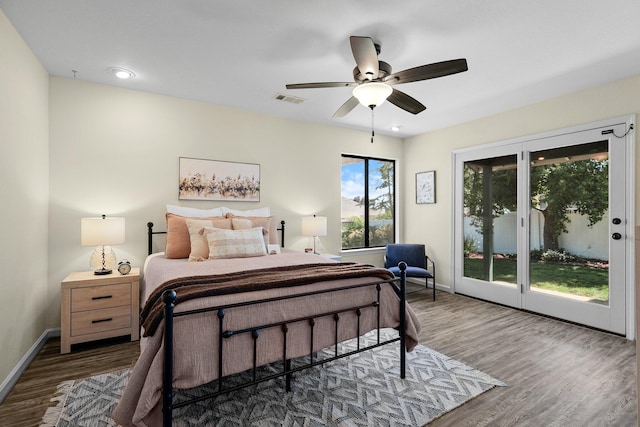 2820 Howard Dr, Redding, CA 96001 - bedroom with access to outside, wood finished floors, and ceiling fan