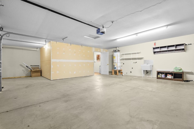 2820 Howard Dr, Redding, CA 96001 - garage with a garage door opener and water heater