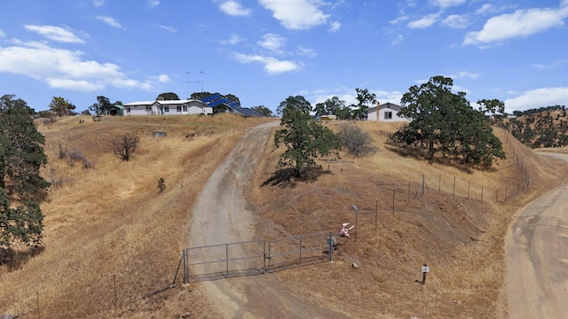 3287 Yolla Bolly Rd, Igo, CA 96047 - view of dirt / gravel driveway with a gate and a view of rural / pastoral area