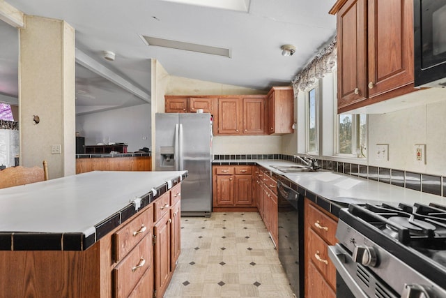 3287 Yolla Bolly Rd, Igo, CA 96047 - kitchen with black appliances, light flooring, vaulted ceiling, healthy amount of natural light, and brown cabinetry