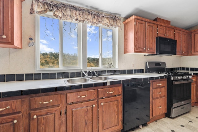 3287 Yolla Bolly Rd, Igo, CA 96047 - kitchen featuring black appliances, tile counters, brown cabinetry, and light flooring