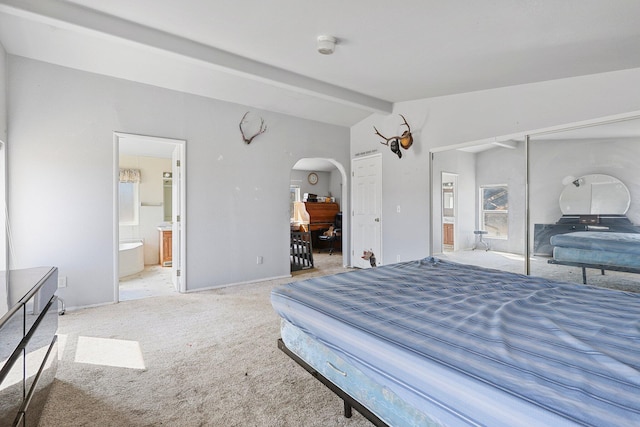 3287 Yolla Bolly Rd, Igo, CA 96047 - carpeted bedroom with arched walkways, vaulted ceiling, a closet, and ensuite bathroom