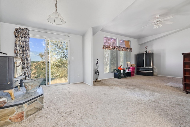 3287 Yolla Bolly Rd, Igo, CA 96047 - living area with a wood stove, carpet floors, and a ceiling fan