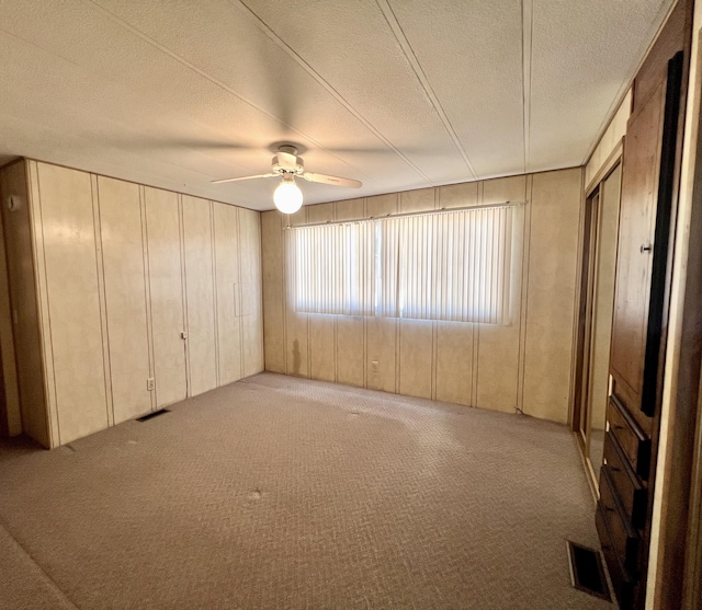 4784 White River Dr, Redding, CA 96003 - spare room featuring carpet, a ceiling fan, and a textured ceiling