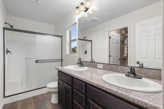 3525 Humbug Dr, Anderson, CA 96007 - full bath featuring a shower stall, wood finished floors, and double vanity
