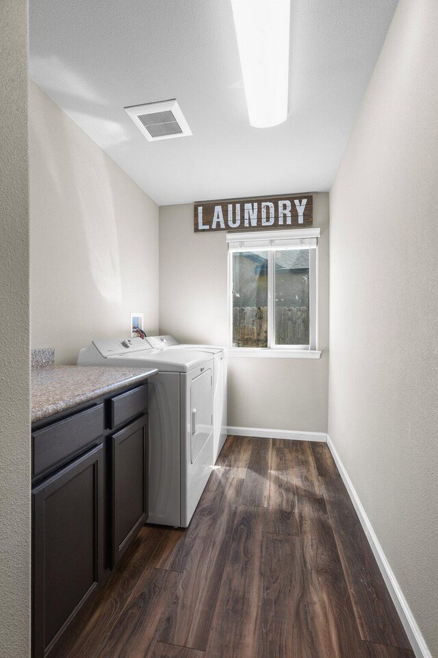 3525 Humbug Dr, Anderson, CA 96007 - washroom with cabinet space, dark wood-style floors, and washer and dryer