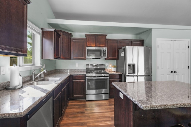3525 Humbug Dr, Anderson, CA 96007 - kitchen featuring appliances with stainless steel finishes, dark wood-type flooring, dark brown cabinets, and light stone counters