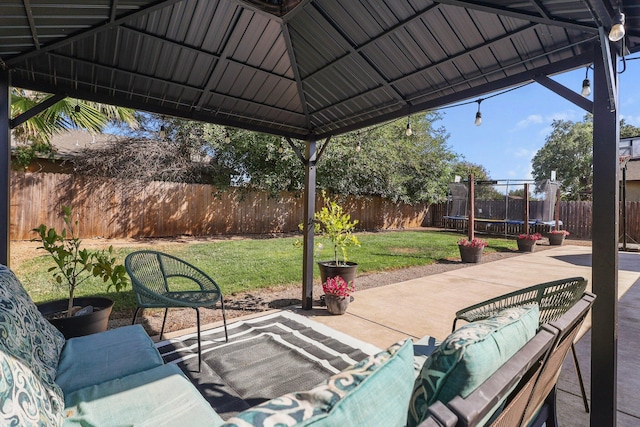 3525 Humbug Dr, Anderson, CA 96007 - fenced backyard with a trampoline, a patio area, a gazebo, and an outdoor living space