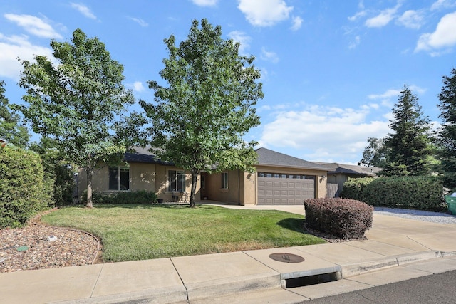 3525 Humbug Dr, Anderson, CA 96007 - ranch-style home featuring a garage, driveway, a front lawn, and stucco siding
