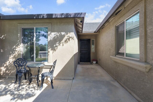 3525 Humbug Dr, Anderson, CA 96007 - property entrance featuring stucco siding and a patio area