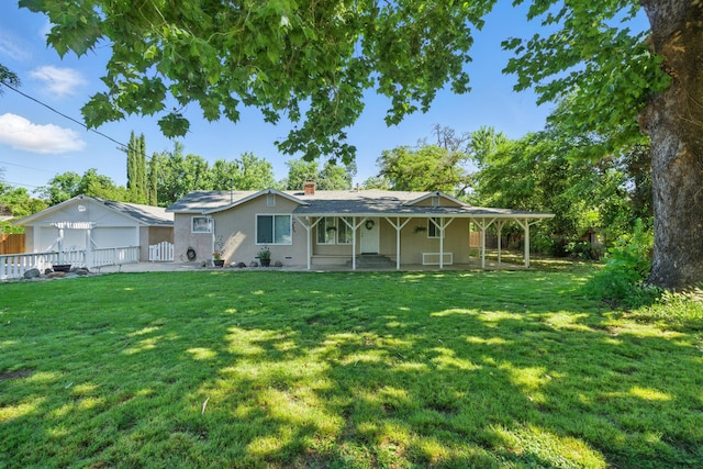 3351 Nicolet Ln, Redding, CA 96001 - rear view of house featuring a chimney, covered porch, and stucco siding