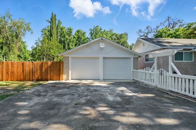 3351 Nicolet Ln, Redding, CA 96001 - view of side of home featuring an outdoor structure, a pergola, driveway, and a garage