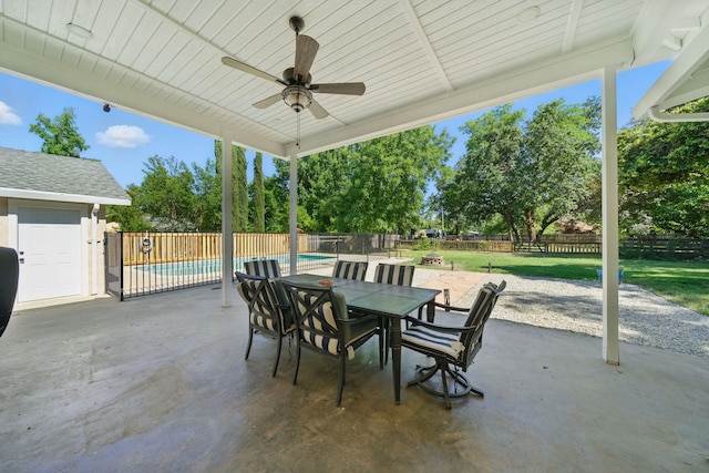 3351 Nicolet Ln, Redding, CA 96001 - fenced backyard with a patio, a ceiling fan, and outdoor dining space