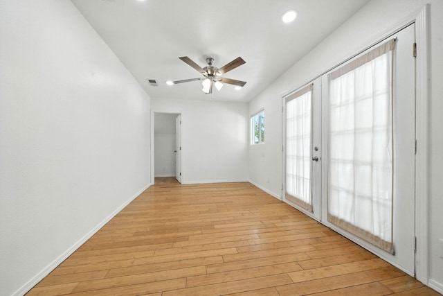 3351 Nicolet Ln, Redding, CA 96001 - empty room with a ceiling fan, light wood-style flooring, recessed lighting, and french doors