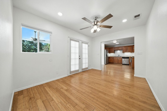 3351 Nicolet Ln, Redding, CA 96001 - unfurnished living room with light wood-style flooring, a ceiling fan, and recessed lighting