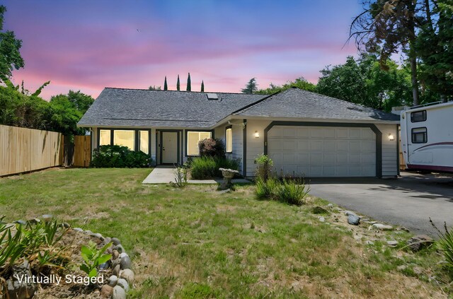 3385 Pioneer Ln, Redding, CA 96001 - single story home featuring a garage, asphalt driveway, and a shingled roof