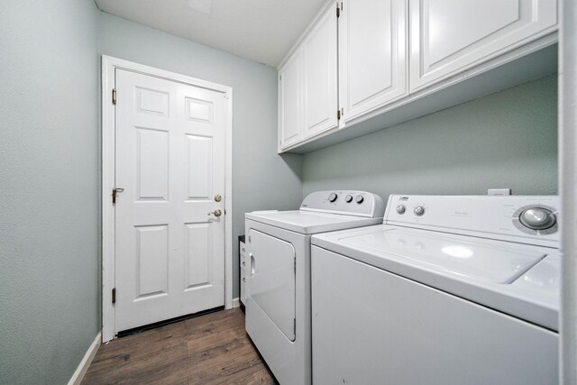 3385 Pioneer Ln, Redding, CA 96001 - laundry room featuring washing machine and dryer, dark wood finished floors, and cabinet space