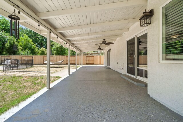3385 Pioneer Ln, Redding, CA 96001 - fenced backyard featuring a ceiling fan and a patio area