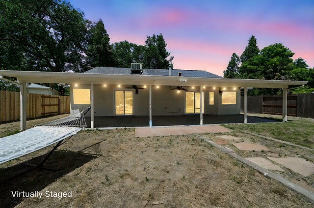 3385 Pioneer Ln, Redding, CA 96001 - back of property with ceiling fan, a patio area, and a fenced backyard
