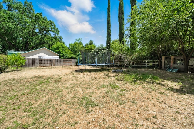 3385 Pioneer Ln, Redding, CA 96001 - fenced backyard featuring a trampoline