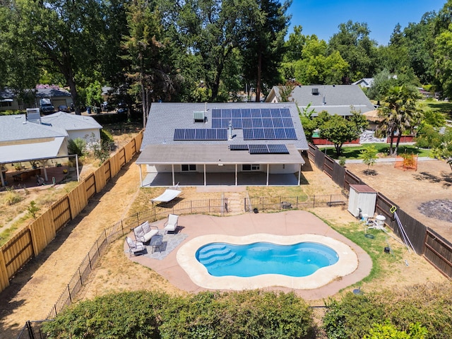 3385 Pioneer Ln, Redding, CA 96001 - back of property featuring roof mounted solar panels, a patio area, and a fenced backyard