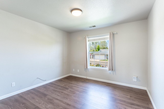 2773 Crystal Tree Dr, Redding, CA 96001 - empty room featuring dark wood-type flooring and baseboards