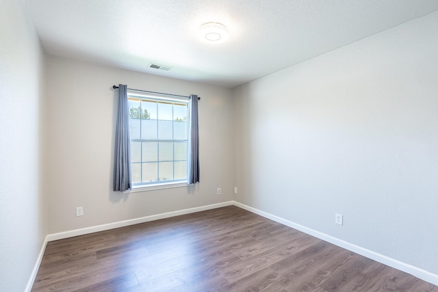 2773 Crystal Tree Dr, Redding, CA 96001 - unfurnished room with dark wood finished floors and baseboards