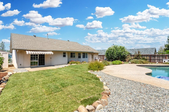 2773 Crystal Tree Dr, Redding, CA 96001 - rear view of house with a patio area, a fenced backyard, stucco siding, and a shingled roof