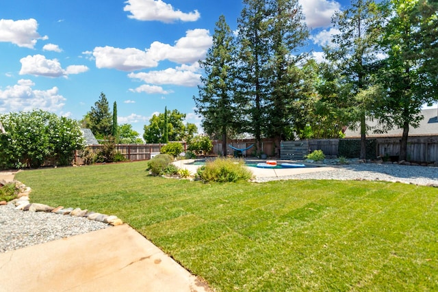 2773 Crystal Tree Dr, Redding, CA 96001 - fenced backyard featuring a patio area
