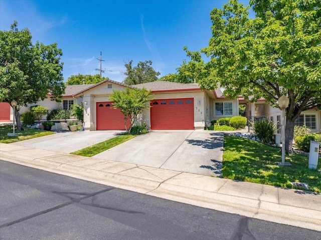 732 Stonebriar Trl, Redding, CA 96003 - single story home with an attached garage, stucco siding, driveway, and a front lawn