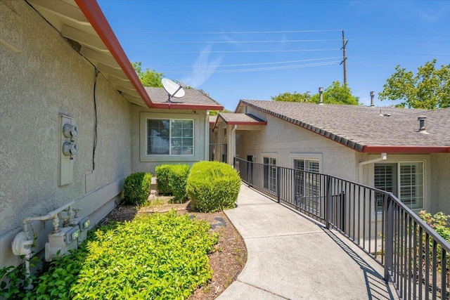 732 Stonebriar Trl, Redding, CA 96003 - view of exterior entry featuring stucco siding and a balcony