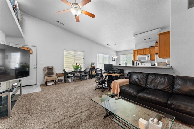 732 Stonebriar Trl, Redding, CA 96003 - living room with ceiling fan, a desk, vaulted ceiling, and light carpet