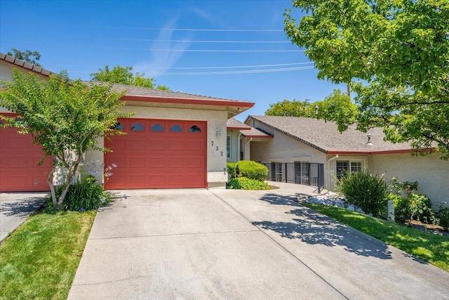 726 Stonebriar Trl, Redding, CA 96003 - ranch-style home featuring driveway, stucco siding, and a garage